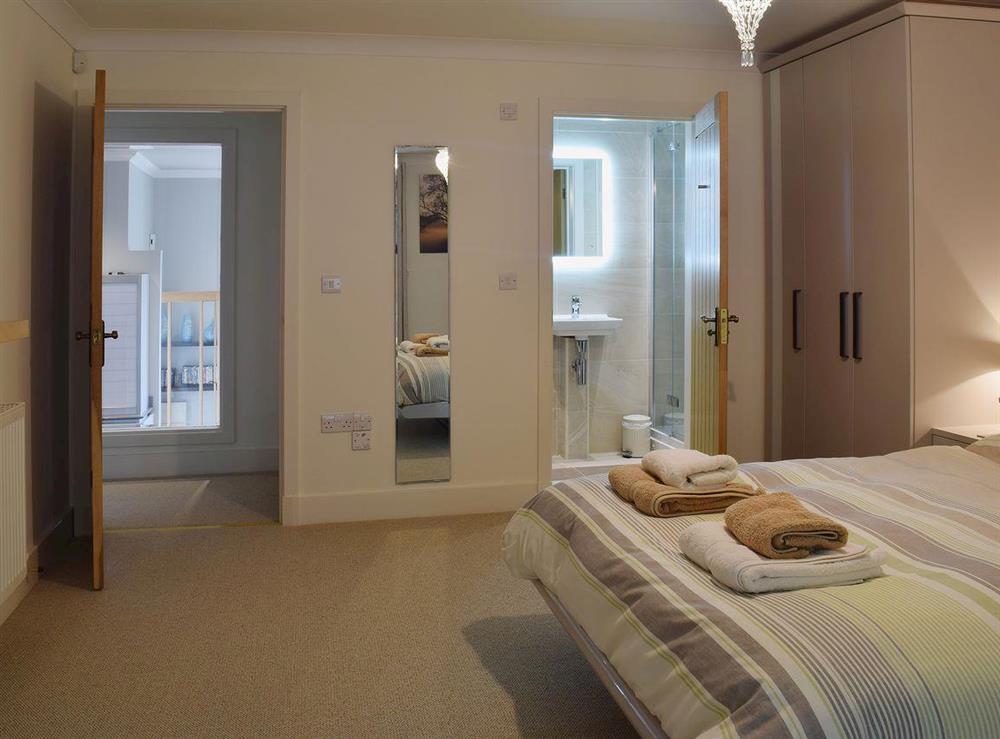 The addition of an en suite shower room adds to the luxurious feel of the double bedroom at 7 Ladstock Hall (deluxe) in Keswick, Cumbria