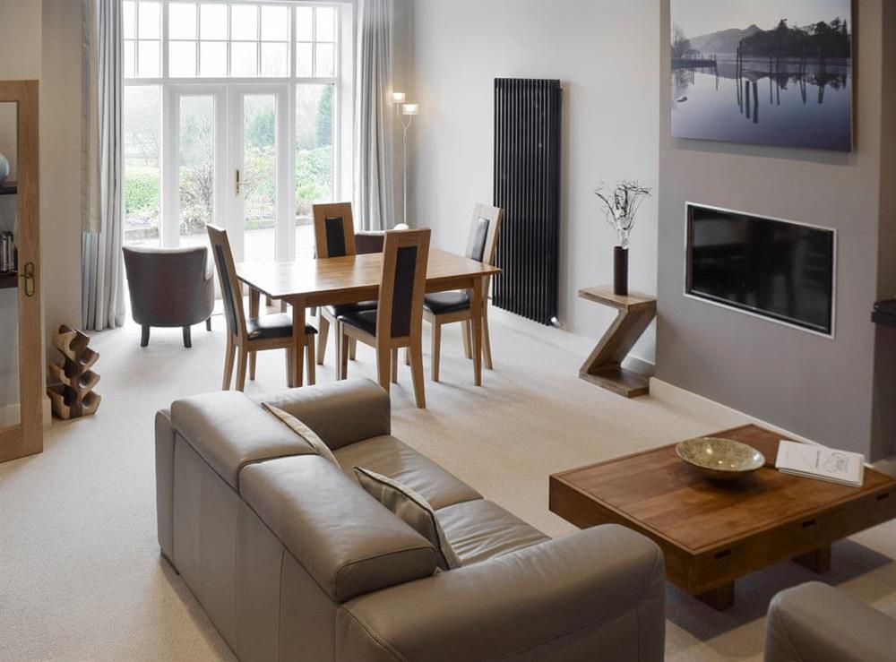 The open aspect of the living areas is enhanced by the use of a welcoming warm palette at 7 Ladstock Hall (deluxe) in Keswick, Cumbria