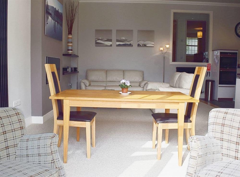 The well proprtioned dining table sits in a prominent position in the open living area at 7 Ladstock Hall (deluxe) in Keswick, Cumbria