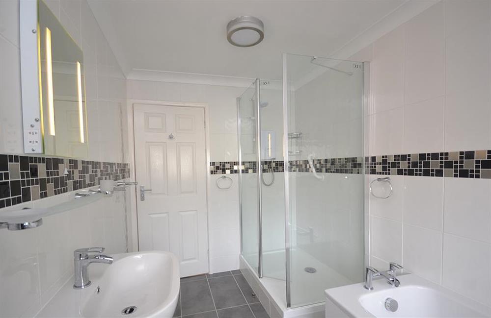 The bathroom boasts a bath and seperate shower at 7 Mayflower Court, Dartmouth