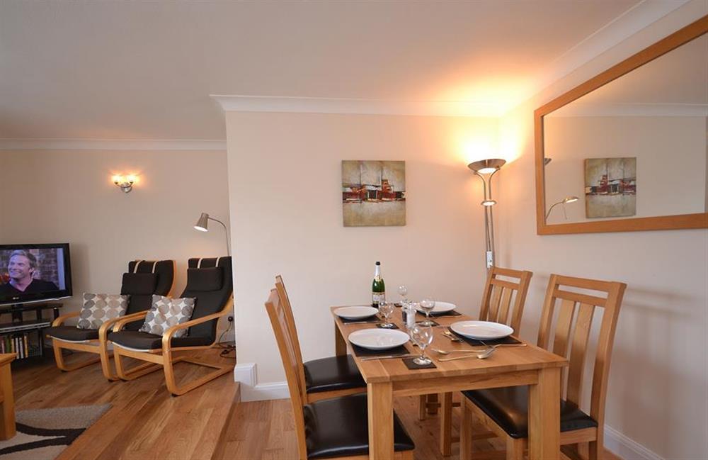 The dining table comfortably seats 4 guests at 7 Mayflower Court, Dartmouth