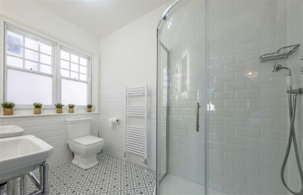 First floor: En-suite  with rain forest shower, double sink, WC and wash basin (photo 2) at 7 Montague Road, Sheringham