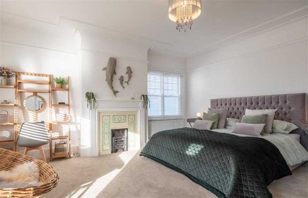 First floor: Master bedroom with a super-king size bed, dressing room with walk-in wardrobe, ornamental fireplace, sofa and balcony overlooking the garden and golf course