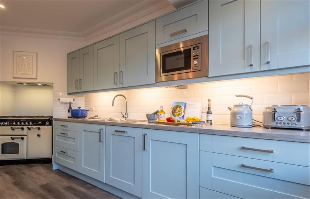 Ground floor: Well-equipped kitchen with a five burner gas hob Rangemaster with an electric oven and microwave