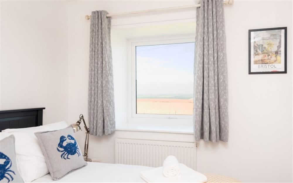 Another view of the main bedroom with a glimpse of the far reaching views. at 7 Moor Farm Cottages in East Portlemouth