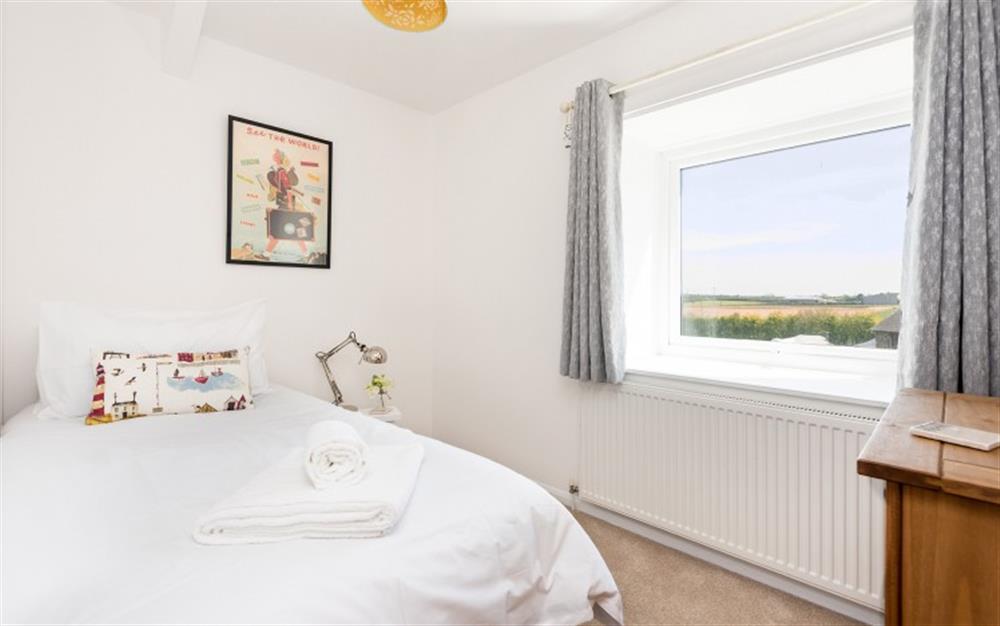 Bedroom 2 is small but pretty and has big views! at 7 Moor Farm Cottages in East Portlemouth