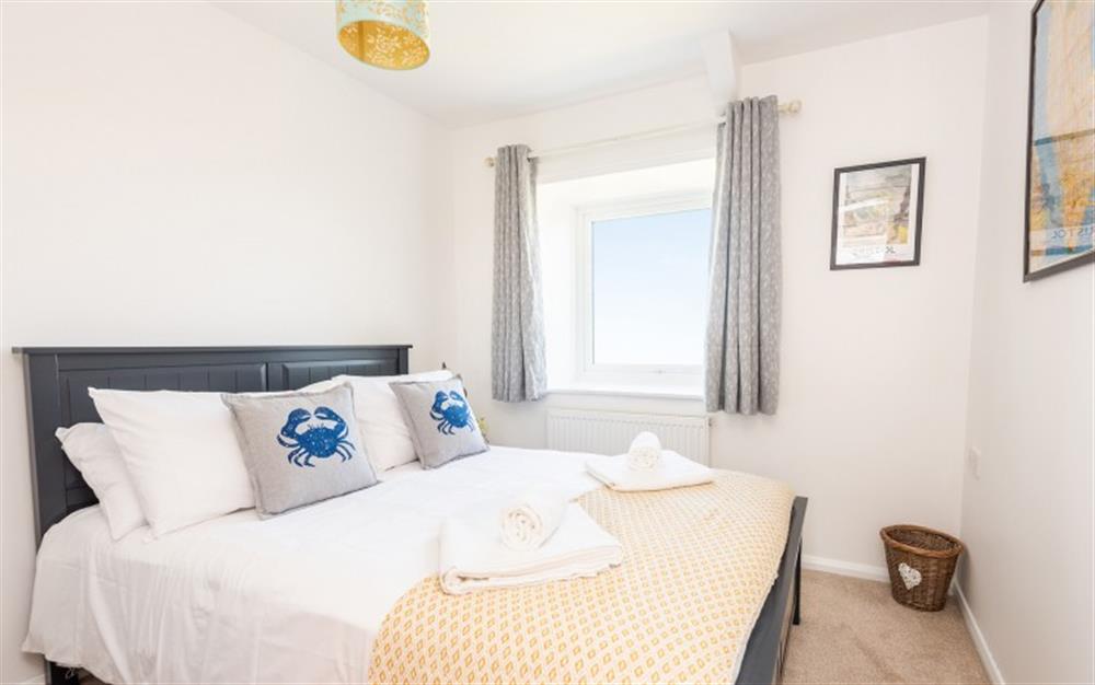 The main bedroom with views across the countryside at 7 Moor Farm Cottages in East Portlemouth
