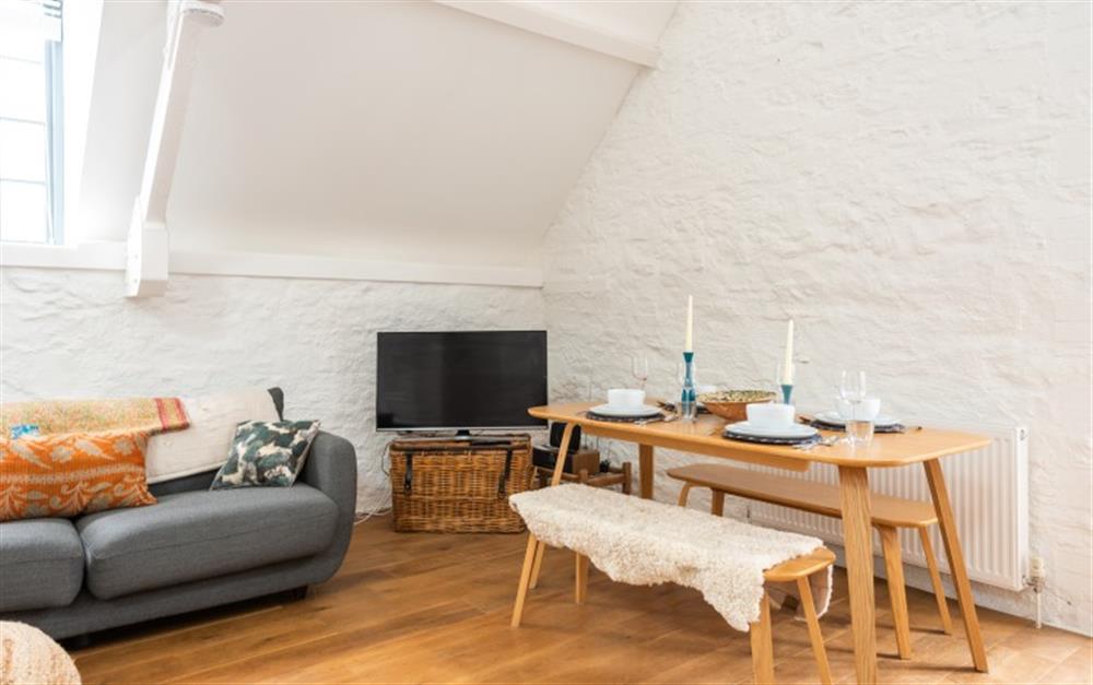 Dining area with table and bench seating for 4. at 7 Staverton Mill in Totnes