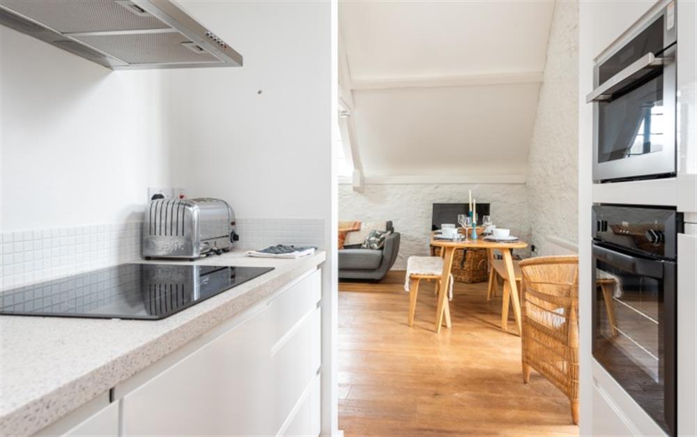 Galley kitchen through to the dining and sitting room. at 7 Staverton Mill in Totnes