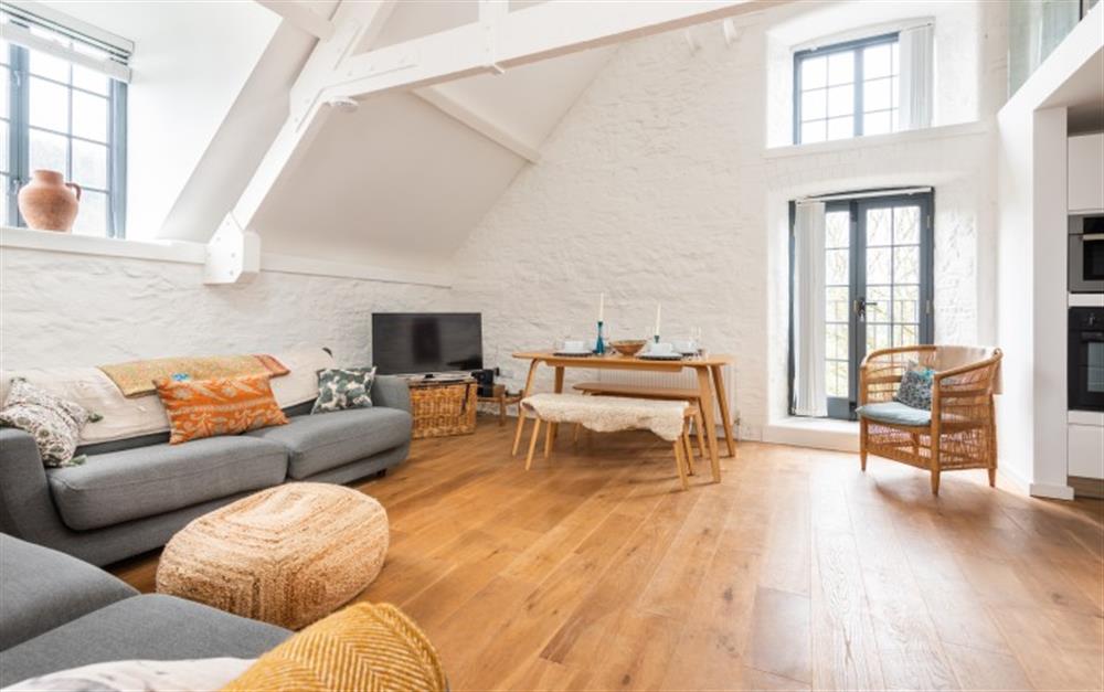 Stylishly presented galleried sitting room with vaulted ceilings and Juliet balcony. at 7 Staverton Mill in Totnes