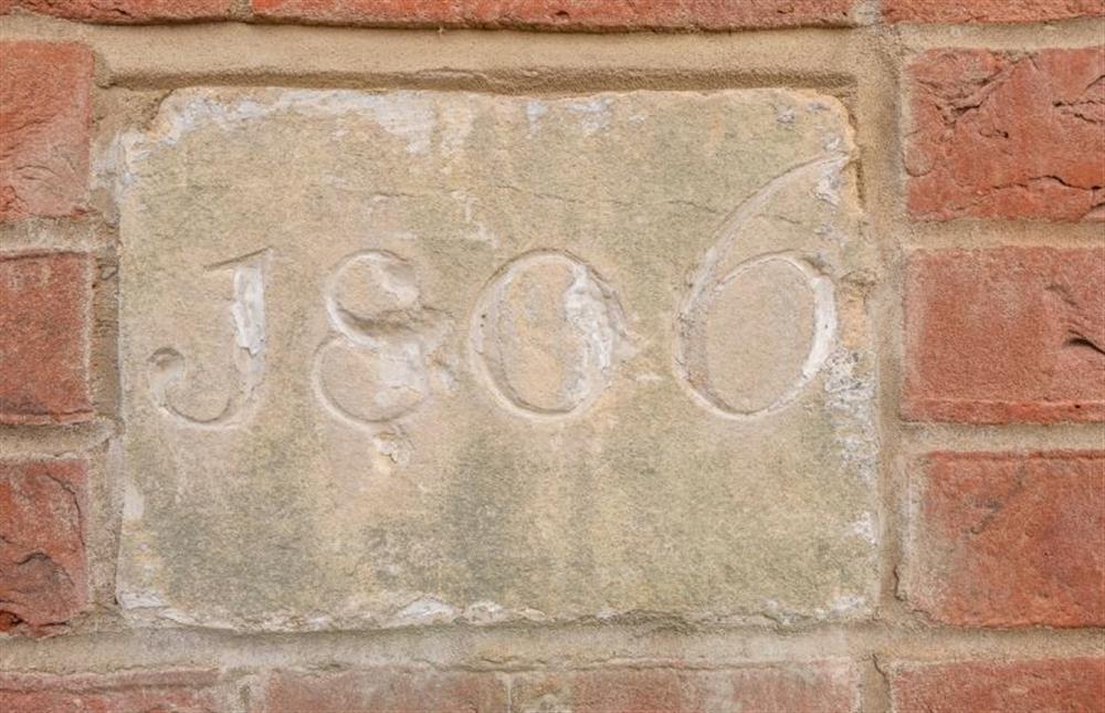 Wall plaque at Swan Court at 7 Swan Court, Fakenham