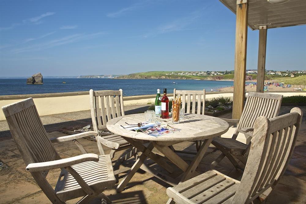 Enjoy stunning views out to sea and over the beach from the large patio area accessed directly from the lounge at 7 Thurlestone Rock Apartments in , Kingsbridge