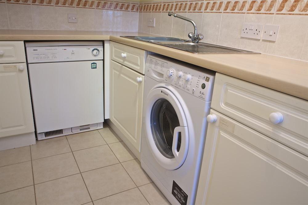 Separate utility area with washing and drying facilities at 7 Thurlestone Rock Apartments in , Kingsbridge