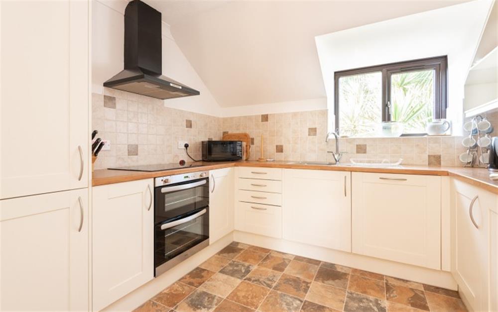 The spacious kitchen has plenty of cupboards for all those essentials at 73 Upper Barn in Maenporth
