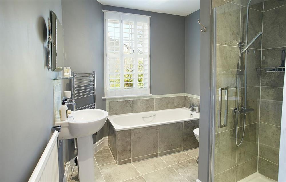 Family bathroom with walk in shower at 7a Cathedral Green, Wells