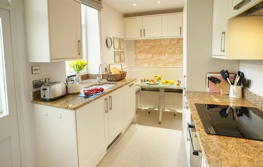 Kitchen with dining area at 7a Cathedral Green, Wells