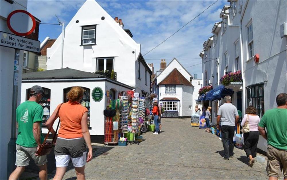 View of the cobbled street and shops at 8 Admirals Court in Lymington