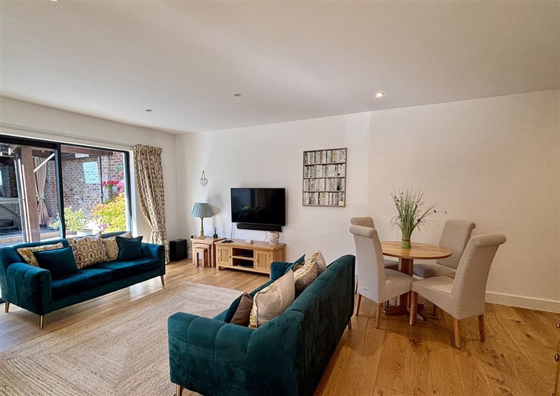 Relax in the living area at 8 Church Road, Ferndown