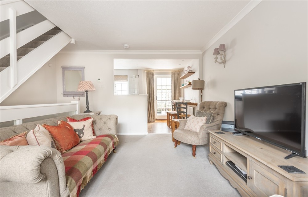 Relax in the living area at 8 Kings Cottages in Salcombe