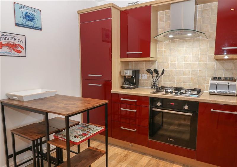 This is the kitchen at 8 Pen Llanw Tides Reach, Rhosneigr