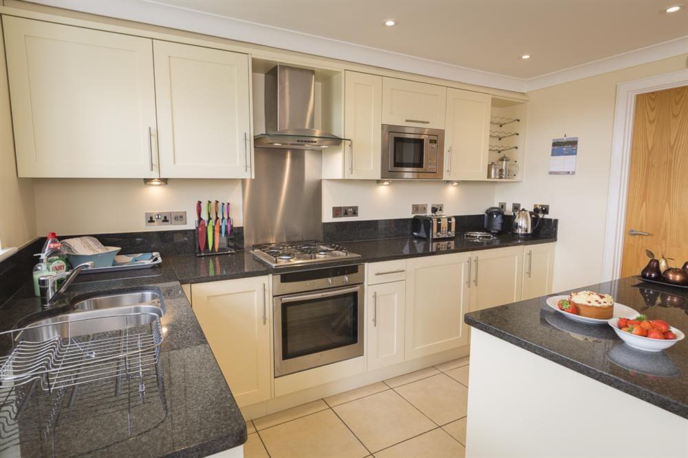 Lovely fitted kitchen with granite worktops and Neff appliances at 8 Thurlestone Beach Apartments in Thurlestone, Nr Kingsbridge