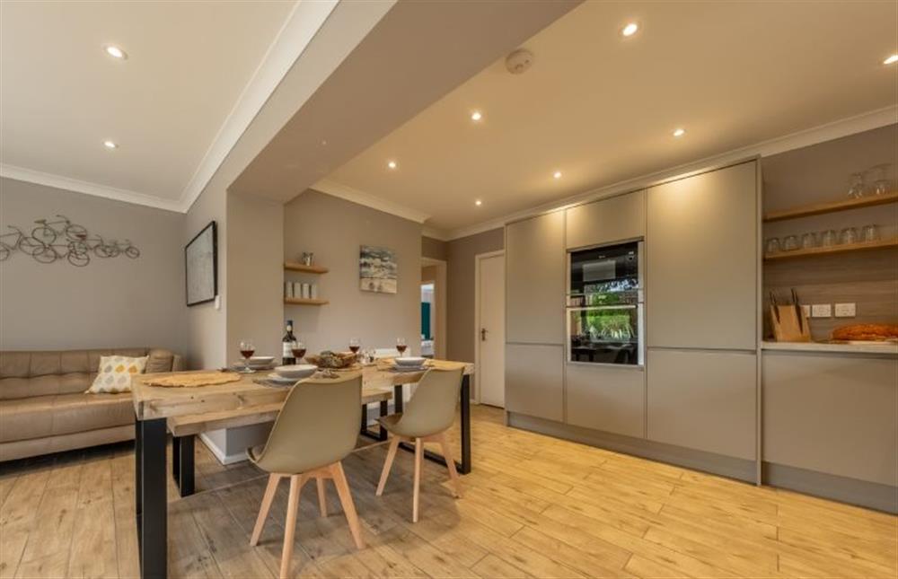 Dining table with seating for four guests at 8 Town Close, Holt
