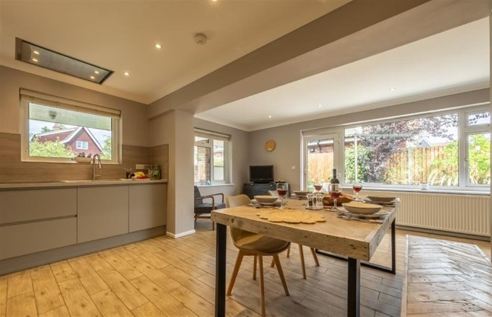 From kitchen to dining area with door to the garden at 8 Town Close, Holt