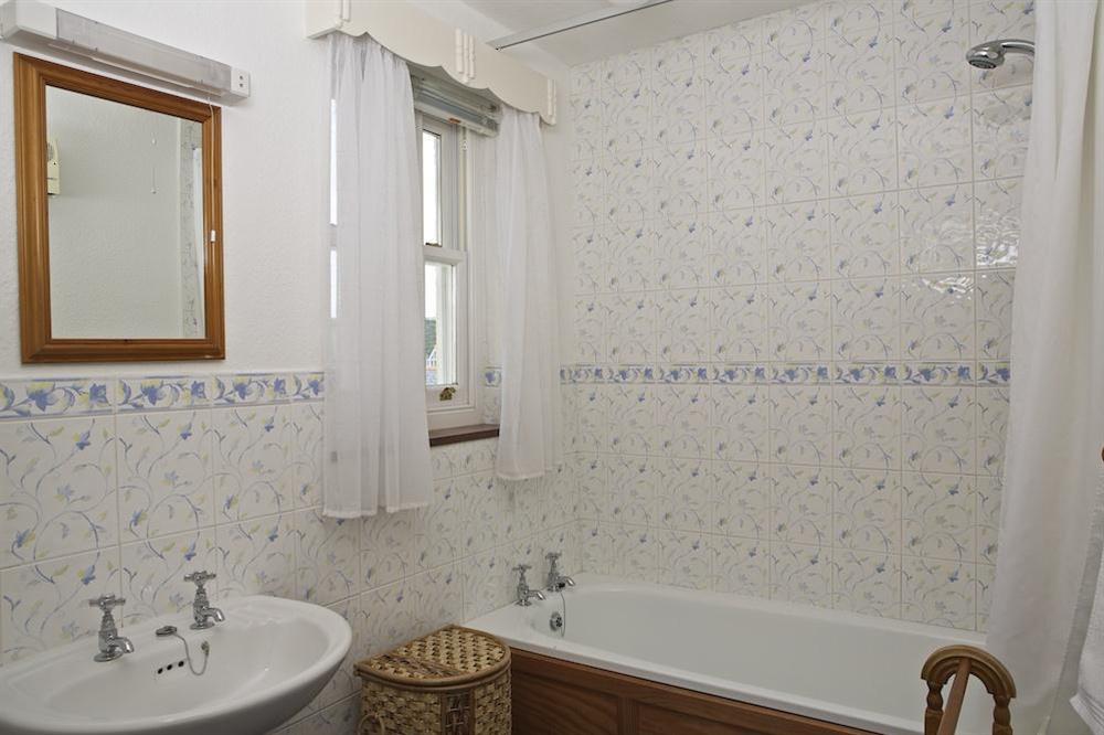 Bathroom with bath and shower over at 8b Fore Street in , Salcombe