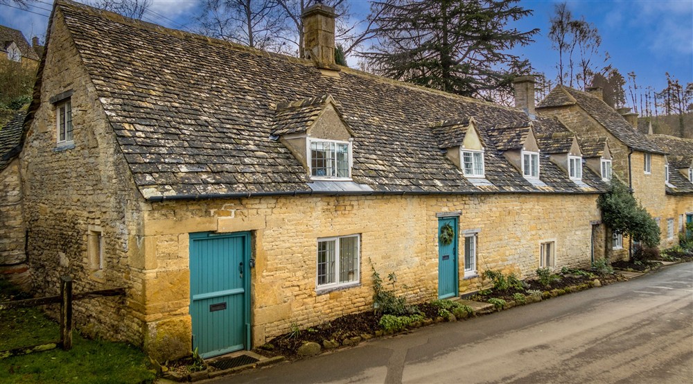 The exterior of Distons Cottage, Gloucestershire at 9 Arlington Row in Cirencester, Gloucestershire