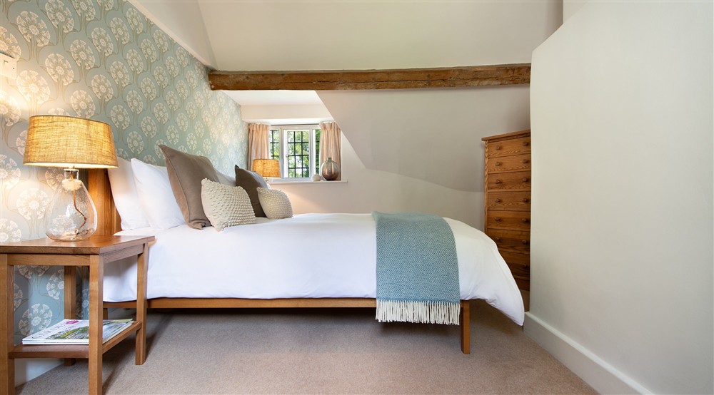 The king-size bedroom at 9 Arlington Row in Cirencester, Gloucestershire