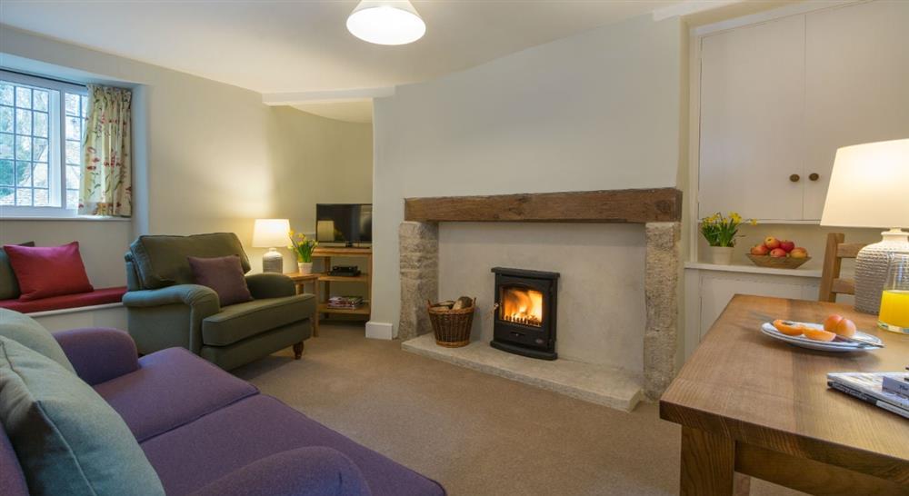 The pleasant sitting room at 9 Arlington Row in Cirencester, Gloucestershire