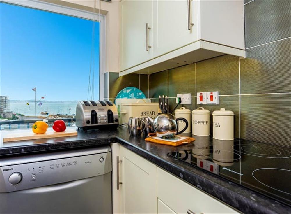 Well appointed kitchen with spectacular views at 9 Dolphin Court in Brixham, South Devon