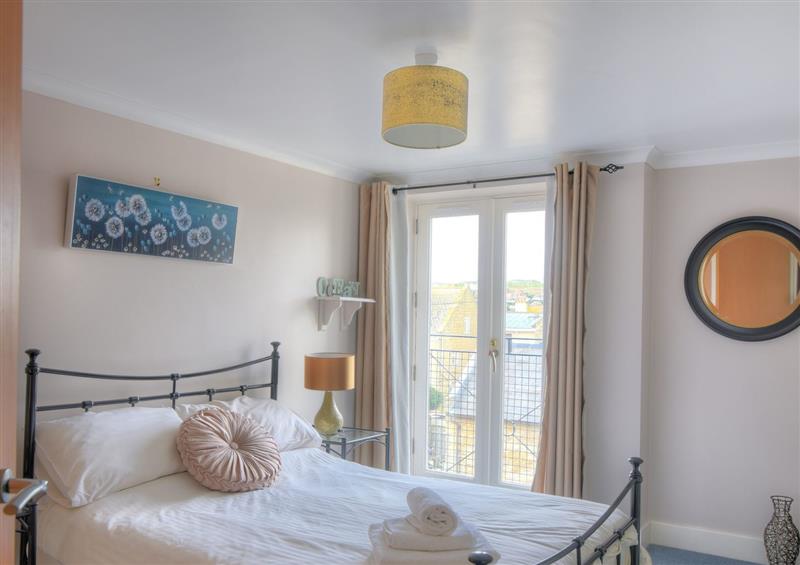 A bedroom in 9 Maritime House at 9 Maritime House, West Bay