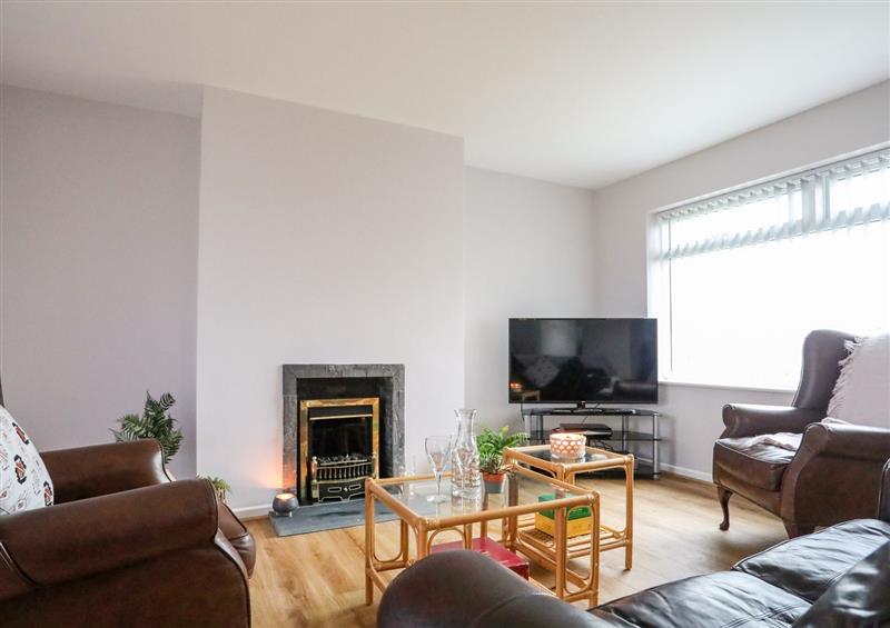 Relax in the living area at 9 Minffordd, Benllech