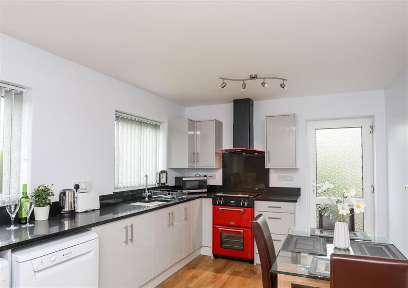 This is the kitchen at 9 Minffordd, Benllech
