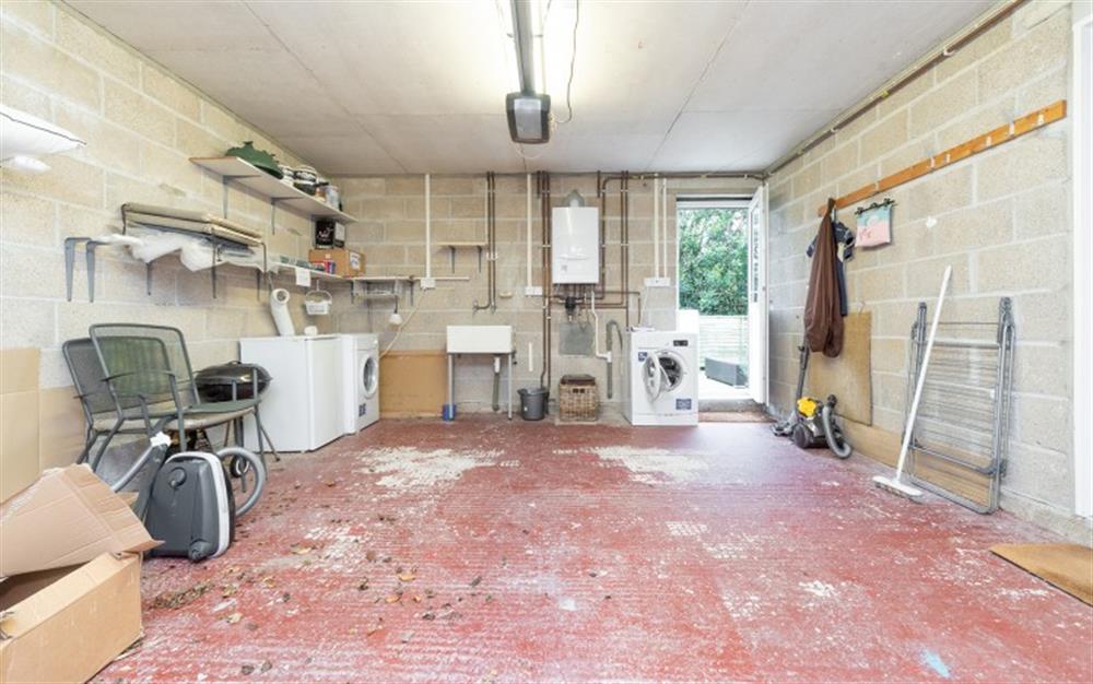 The garage with access to patio at 9 Rosemount Court in Salcombe