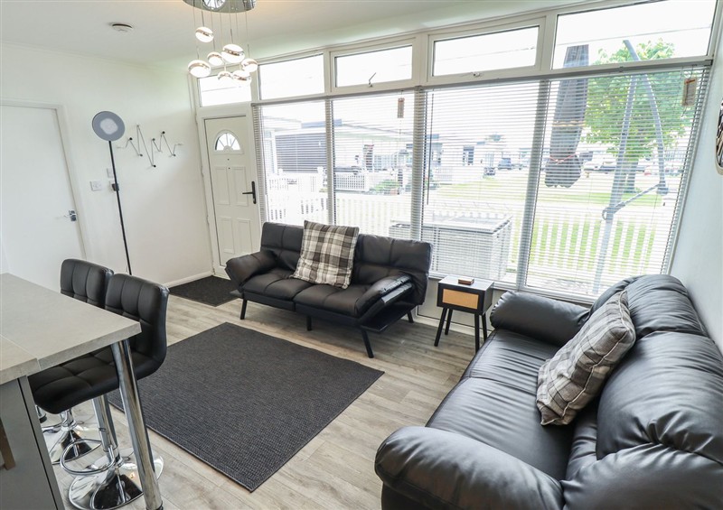 Relax in the living area at 99 Cherry Park, Chapel St Leonards