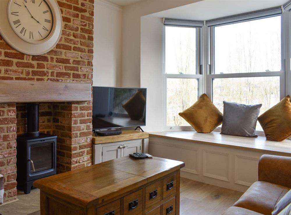 Welcoming living room with wood burner at Abbey View in Whitby, Yorkshire, North Yorkshire