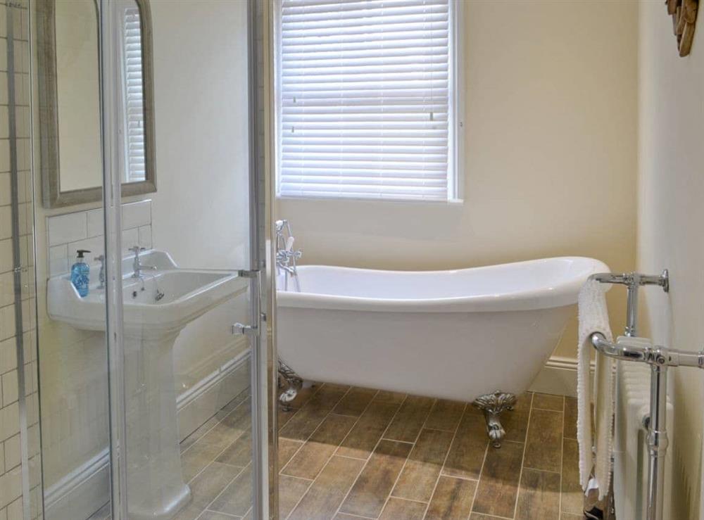Gorgeous bathroom with standalone slipper bath at Abbeydale Town House in Whitby, North Yorkshire
