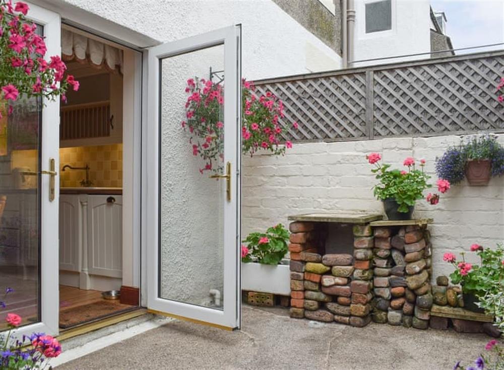 Courtyard garden with French doors to kitchen/diner at Abbie House in St Monans, Fife