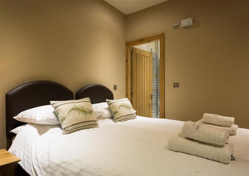 This is a bedroom at Abbots Reading Cottage, Lakeside
