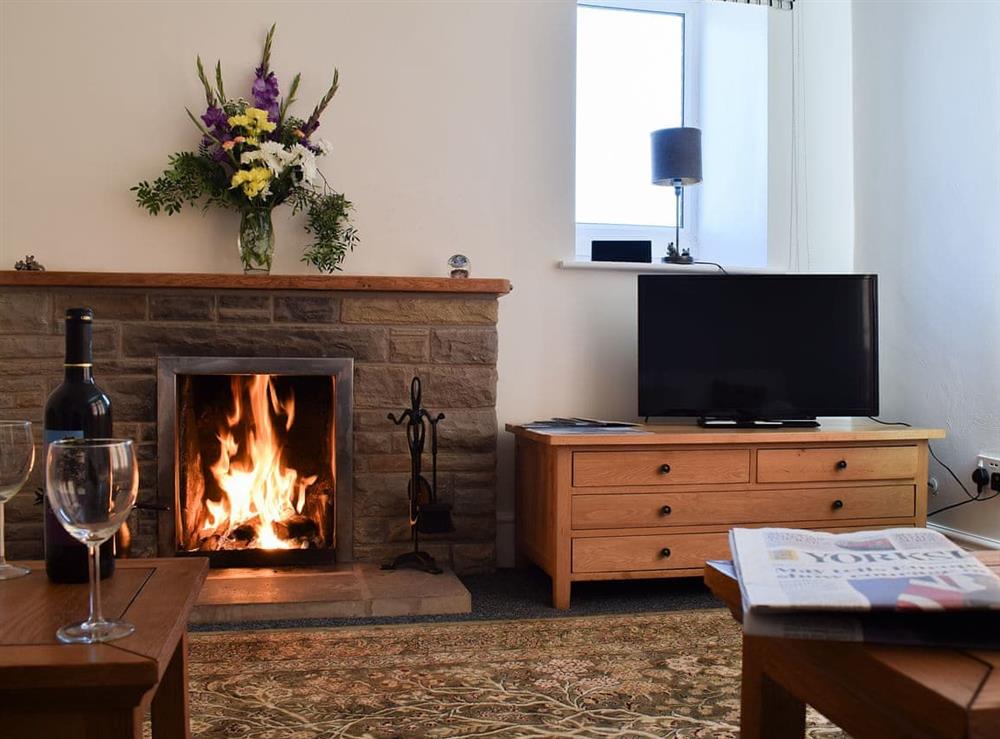 Relax and warm yourself in front of a roaring fire at Abbotts Close Cottage in Sutton-under-Whitestonecliffe, near Thirsk, North Yorkshire