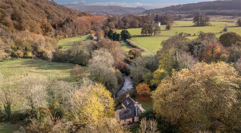 An aerial view of Abermydyr holiday cottage, with the villa on the Llanerchaeron estate in the distance, Ceredigion at Abermydyr in Aberaeron, Ceredigion