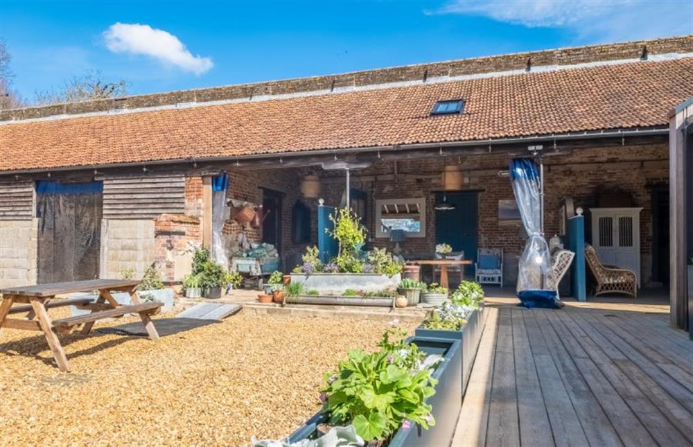 Exterior: The gravelled courtyard with accessible seating  at Able Stables, East Rudham near Kings Lynn