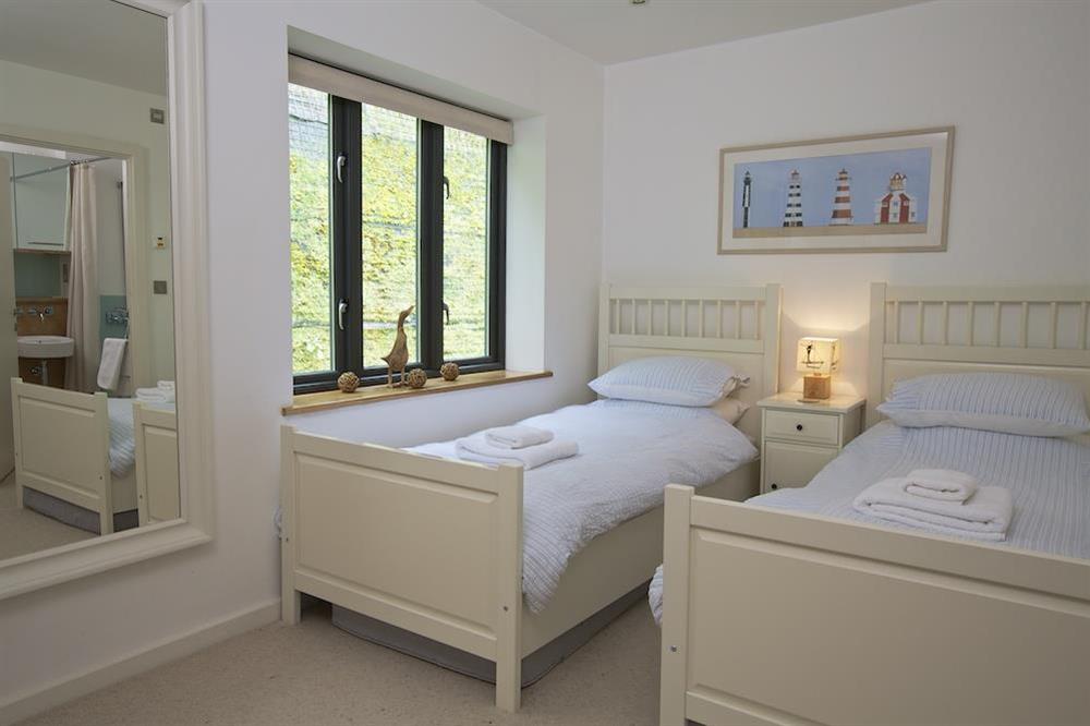 Twin bedroom with en suite bathroom at About Tide in , Dartmouth