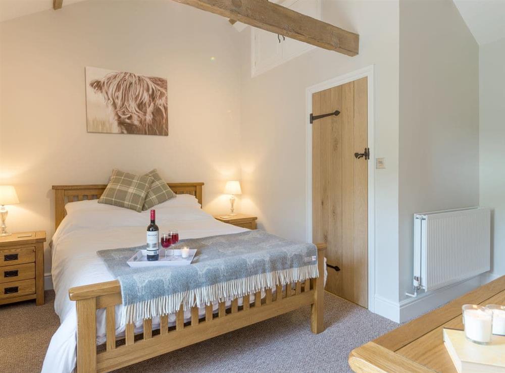Exposed beams within the double bedroom at Abrahams Cottage in Langthwaite, near Leyburn, North Yorkshire