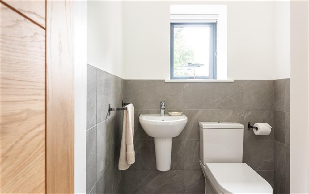 Cloakroom with w/c and basin