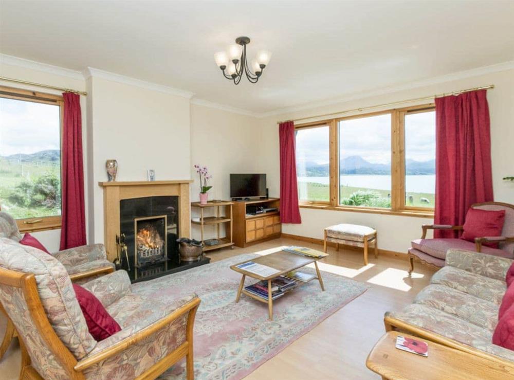 Spacious living room, windows overlooking Gairloch Bay to the magnificent Torridon Mountains at Ach-na-Clachan in Gairloch, Wester Ross., Ross-Shire