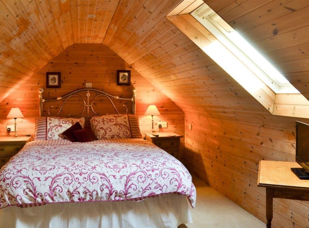 Charming and romantic double bedroom with sloping ceilings at Acorn Barn in Laytham, near York, North Yorkshire