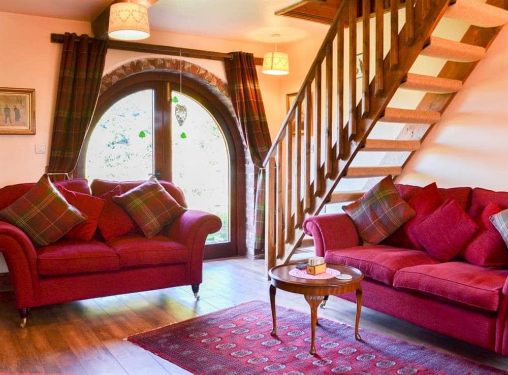 Warm and welcoming living area at Acorn Barn in Laytham, near York, North Yorkshire